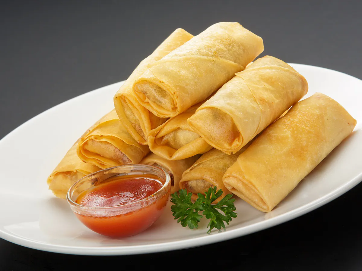 Crispy fried spring rolls served with sweet chili dipping sauce at Great Wall, a Chinese Restaurant in Greenwood